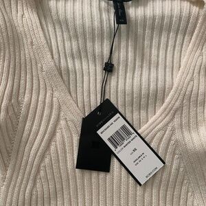 BCBG cream color v neck sweater. Ballon sleeves. Hip and unique style